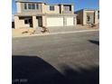 Two-story home featuring a spacious driveway and modern architectural design at 7142 Twilight Rider Ct, Las Vegas, NV 89118