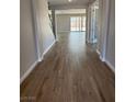 Spacious entryway with wood-style tile flooring and open sightlines to the living areas at 7199 Twilight Rider Ct, Las Vegas, NV 89118