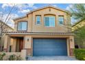Charming two-story home featuring neutral stucco, a two-car garage, and manicured front yard at 7629 Rosebark Cliffs St, North Las Vegas, NV 89084