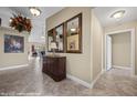 Spacious foyer with a decorative mirror and tile flooring at 870 Santa Maria Way, Mesquite, NV 89027