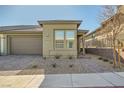 Inviting single-story home with well-maintained desert landscaping and brick walkway at 9561 Jadeite Ln, Las Vegas, NV 89143