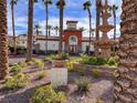 Beautiful clubhouse with a water fountain, palm trees and lovely landscaping at 1525 Spiced Wine Ave # 12103, Henderson, NV 89074