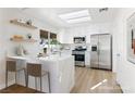 Bright kitchen with white cabinets, stainless steel appliances and quartz countertops at 2612 Springridge Dr, Las Vegas, NV 89134