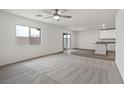 Spacious living room with carpet, sliding glass door to the outside, and bright natural light at 4203 Gold Desert St, North Las Vegas, NV 89032