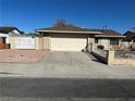 Charming single-story home with desert landscaping, attached garage, and secure front yard at 4816 Greencreek Dr, Las Vegas, NV 89110