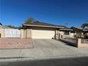 Charming single-story home with desert landscaping, attached garage, and secure front yard at 4816 Greencreek Dr, Las Vegas, NV 89110