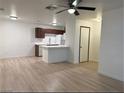 Open kitchen with stainless appliances, island, and a view of living room at 5121 Lindell Rd # 104, Las Vegas, NV 89118