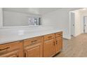 Partial kitchen view showcasing the laminate counters and wood cabinets at 5394 Swenson St # 29, Las Vegas, NV 89119