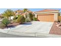 Home exterior featuring a terracotta tile roof and low-maintenance desert landscaping at 5517 Whiteleaf Ct, Las Vegas, NV 89149