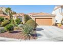 Inviting home exterior with a well-manicured front yard and a terracotta tile roof at 5517 Whiteleaf Ct, Las Vegas, NV 89149