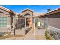 Stunning front entrance boasting a gated courtyard for added privacy and curb appeal at 6316 Canyon Ridge Dr, Las Vegas, NV 89108