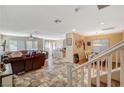 Spacious living room with hardwood floors, ceiling fan, and abundant natural light at 7433 Calzado Dr, Las Vegas, NV 89178