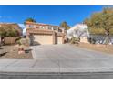 Lovely home featuring a spacious driveway, three-car garage, and low-maintenance landscaping at 8404 Bay Crest Dr, Las Vegas, NV 89128