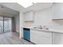 Updated kitchen with modern cabinets, stylish countertops, and stainless steel sink at 228 N Bruce St # D, Las Vegas, NV 89101