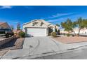 Charming single-story home with a two car garage, neutral paint, and desert landscaping at 3721 Brentcove Dr, North Las Vegas, NV 89032