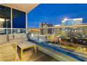 Outdoor balcony with comfortable seating and stunning views of the Las Vegas skyline at night at 4575 Dean Martin Dr # 2400, Las Vegas, NV 89103