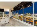 Bright living area featuring panoramic city views through expansive windows at 4575 Dean Martin Dr # 2400, Las Vegas, NV 89103