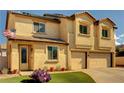 Charming two-story stucco home with a two-car garage and an American flag waving out front at 58 Desert Castle Ct, Henderson, NV 89012