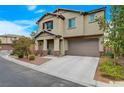 Well-manicured front lawn and charming covered porch enhance the curb appeal of this lovely home at 7856 Pyramid Peak St, Las Vegas, NV 89166