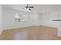 Open living space with tile flooring, abundant natural light, and white walls at 11428 Belmont Lake Dr # 104, Las Vegas, NV 89135