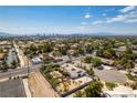 Las Vegas home surrounded by desert landscape and featuring mountain views at 1295 S Tenaya Way, Las Vegas, NV 89117