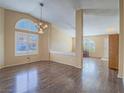 Inviting living room with wood floors, neutral paint, and ample natural light at 1402 Bareback Ct, Henderson, NV 89014