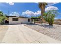 Single-story home with large driveway, mature shade trees and low-maintenance landscaping in a convenient location at 2716 Salt Lake St, North Las Vegas, NV 89030