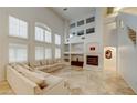 Bright living room features large windows, fireplace, and comfortable seating at 283 Auster Park Ave, Las Vegas, NV 89148