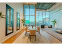 Dining space with mirrors, modern furnishings and striking views through large windows at 360 E Desert Inn Rd # 604, Las Vegas, NV 89109