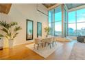 Dining area with modern table, chairs, and bright natural light from large windows at 360 E Desert Inn Rd # 604, Las Vegas, NV 89109