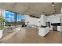 Bright living room featuring floor to ceiling windows and an attached kitchen area at 360 E Desert Inn Rd # 604, Las Vegas, NV 89109