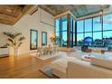 Open-concept living space with hardwood floors, modern decor, and stunning city views at 360 E Desert Inn Rd # 604, Las Vegas, NV 89109
