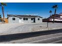 Well-kept single-story home with desert landscaping and a modern driveway at 4818 E Monroe Ave, Las Vegas, NV 89110
