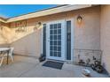 A charming patio features a textured wall, decorative accents, and an outdoor seating area at 798 Shirley Ln, Boulder City, NV 89005