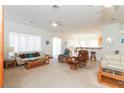 Open-concept living room with ceiling fans and lots of natural light at 814 Lake Hill Dr, Boulder City, NV 89005