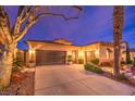 Inviting home with desert landscaping and attached three-car garage at 11342 Winter Cottage Pl, Las Vegas, NV 89135