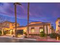 Inviting home featuring desert landscaping, and a two car garage at 11342 Winter Cottage Pl, Las Vegas, NV 89135