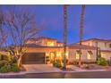 Inviting home featuring desert landscaping, manicured shrubs, and a two car garage at 11342 Winter Cottage Pl, Las Vegas, NV 89135