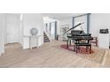 Bright living room with a staircase, and a neutral color scheme at 12125 Arrebol Ave, Las Vegas, NV 89138