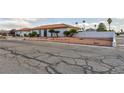 Single-Gathering home with desert landscaping, palm trees, and a spacious driveway at 1780 Westwind Rd, Las Vegas, NV 89146