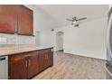 Open floor plan features updated kitchen cabinets, countertop and flooring at 1830 N Buffalo Dr # 2106, Las Vegas, NV 89128