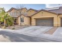 Charming single-Gathering home featuring a two-car garage and desert landscaping at 3934 Jamison Park Ln, North Las Vegas, NV 89032