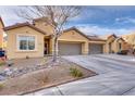 Charming single-Gathering home featuring a two-car garage and desert landscaping at 3934 Jamison Park Ln, North Las Vegas, NV 89032