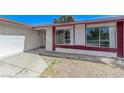 A single-story home featuring neutral gravel landscaping, fresh paint trim, and a covered front entryway at 42 Del Amo Dr, Las Vegas, NV 89110