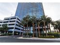 The Martin building facade is shown from street level, highlighting the building's architecture and surrounding landscaping at 4471 Dean Martin Dr # 1105, Las Vegas, NV 89103