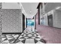 Modern interior hallway design featuring black and white geometric flooring, and custom wall finishes at 4471 Dean Martin Dr # 1105, Las Vegas, NV 89103