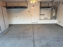 Clean, spacious garage with ample room for storage and a water heater at 4787 Essen Ct, Las Vegas, NV 89147