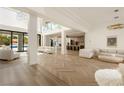 Open concept living area with herringbone floors and luxury furniture at 74 Innisbrook Ave, Las Vegas, NV 89113