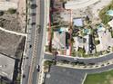 An aerial view shows a large house with a pool, located near a school and a busy street at 861 Majestic Ridge Ct, Henderson, NV 89052