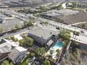 Aerial view of a luxurious home featuring a backyard pool, desert landscaping, and a great location at 861 Majestic Ridge Ct, Henderson, NV 89052